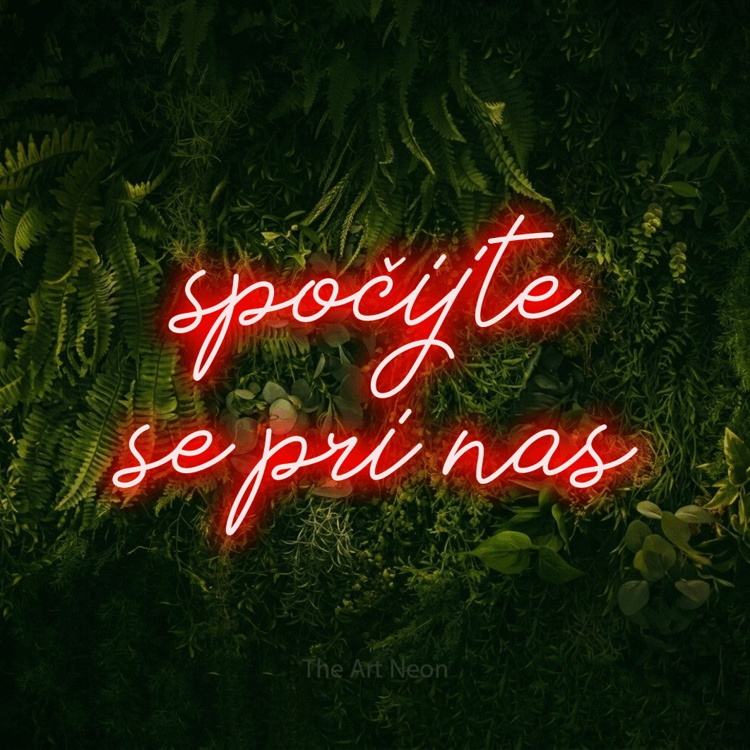 LED neon sign reading “spočijte se pri nas”, arranged in two lines.