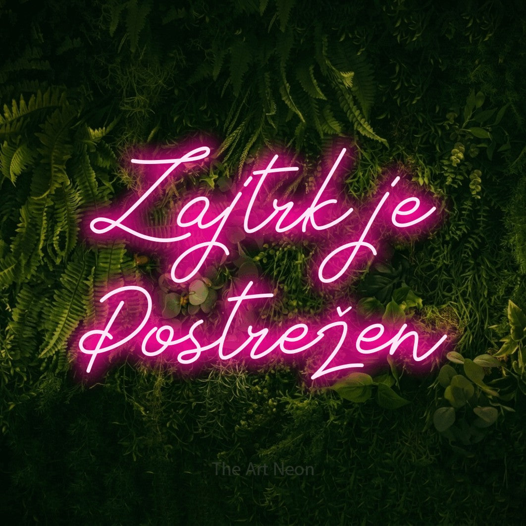 LED neon sign reading “Zajtrk je Postrežen”, arranged in two lines.