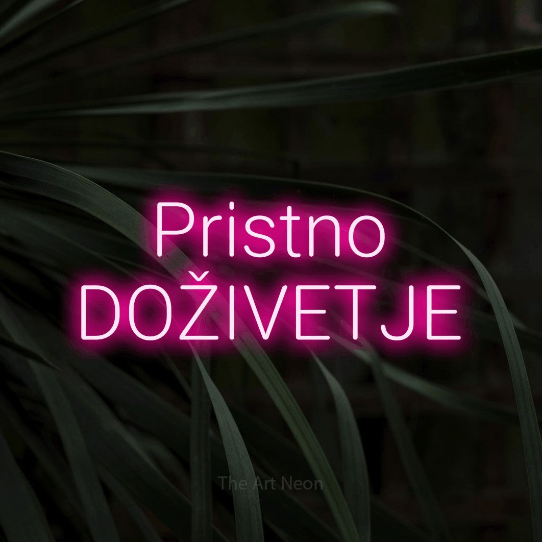 LED neon sign reading “Pristno DOŽIVETJE”, arranged in two lines.