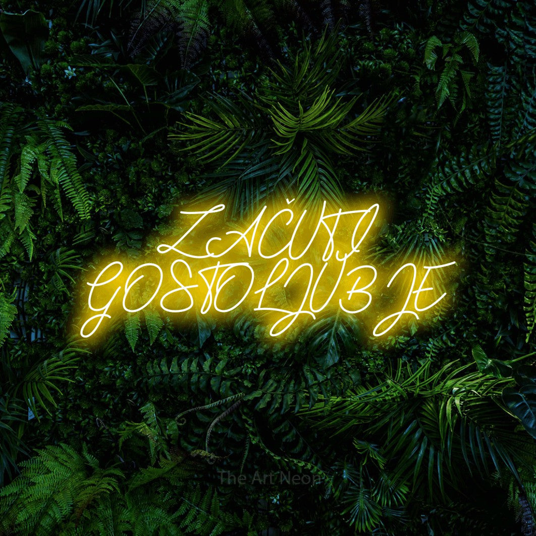 LED neon sign reading “ZAČUTI GOSTOLJUBJE”, arranged in two lines.