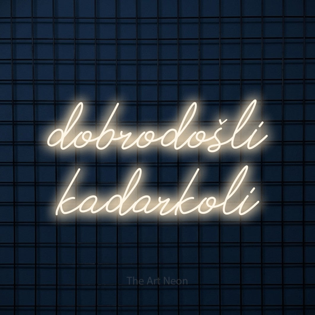 LED neon sign reading “dobrodošli kadarkoli”, arranged in two lines.