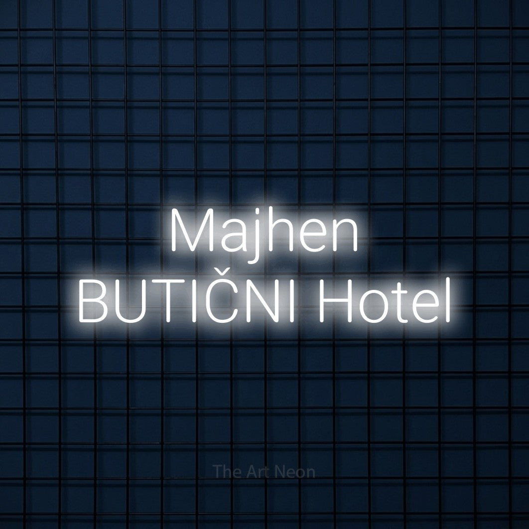 LED neon sign reading “Majhen BUTIČNI Hotel”, arranged in two lines.