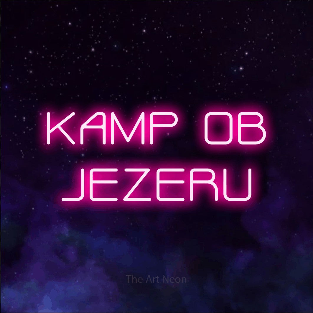 LED neon sign reading “KAMP OB JEZERU”, arranged in two lines.