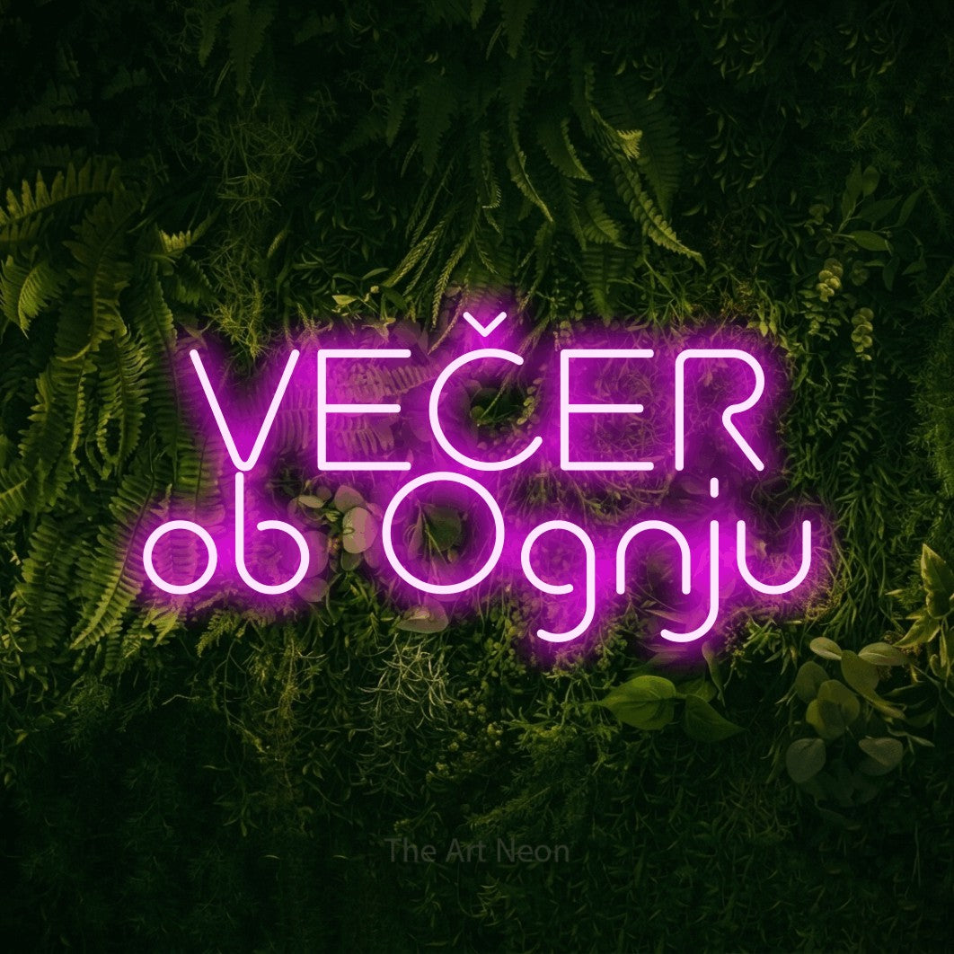 LED neon sign reading “VEČER ob Ognju”, arranged in two lines.