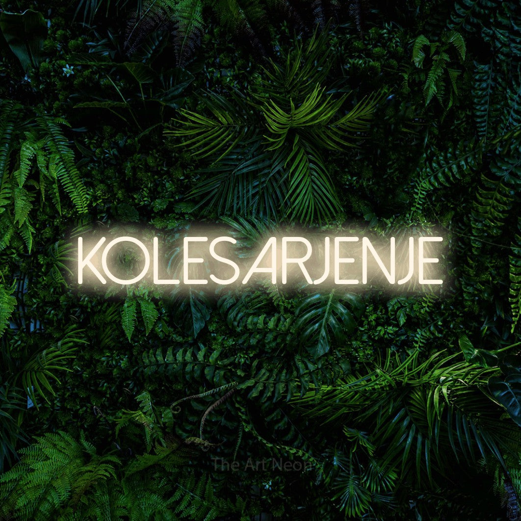 LED neon sign reading “Kolesarjenje”, arranged in a single line.