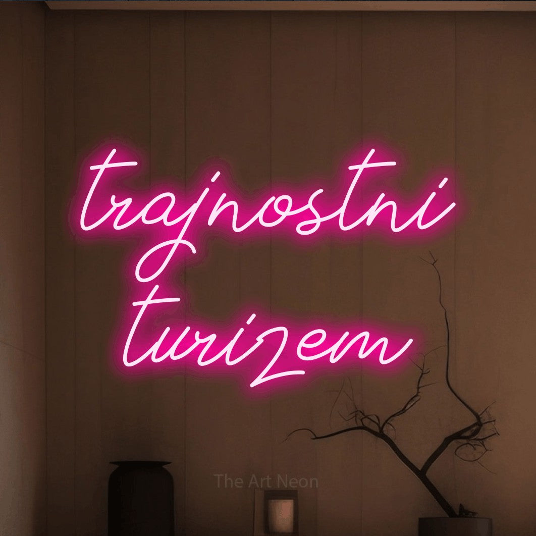 LED neon sign reading “trajnostni turizem”, arranged in two lines.