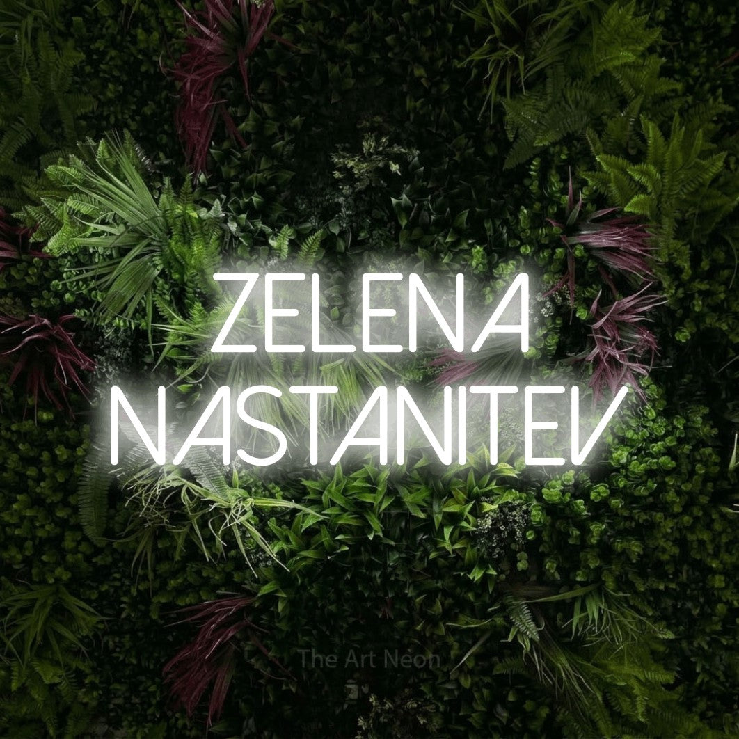LED neon sign reading “ZELENA NASTANITEV”, arranged in two lines.