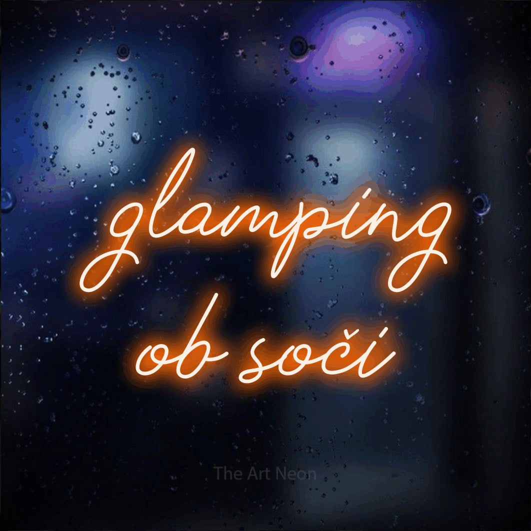 LED neon sign reading “glamping ob soči”, arranged in two lines.
