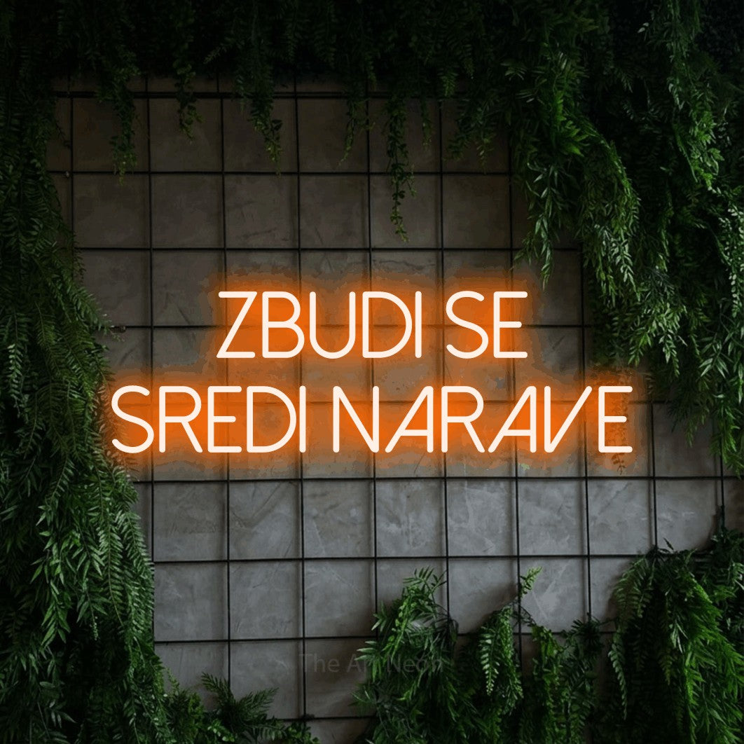 LED neon sign reading “ZBUDI SE SREDI NARAVE”, arranged in two lines.