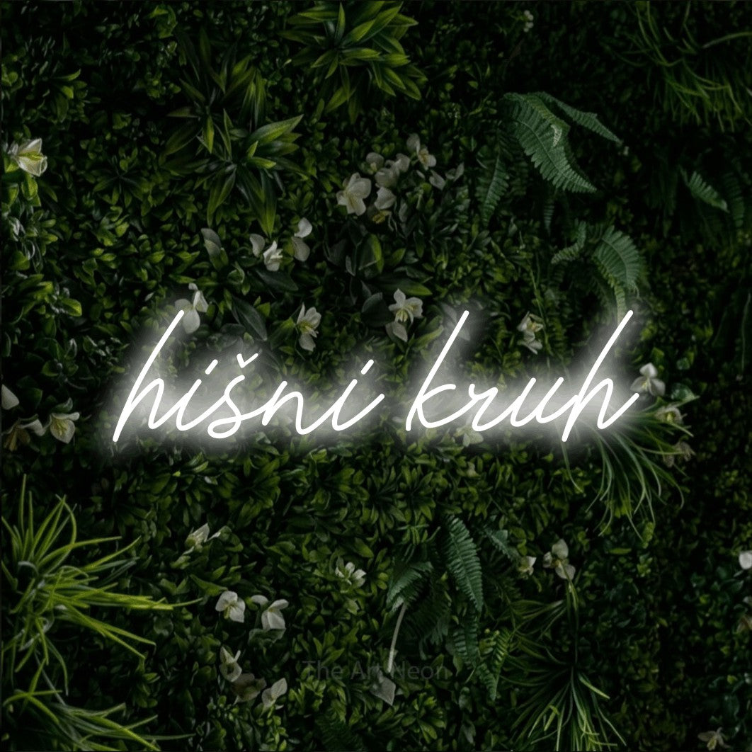 LED neon sign reading “hišni kruh”, arranged in a single line.