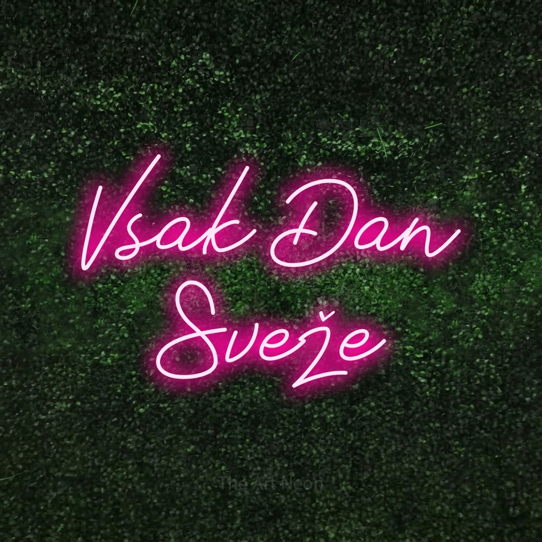 LED neon sign reading “Vsak Dan Sveže”, arranged in two lines.