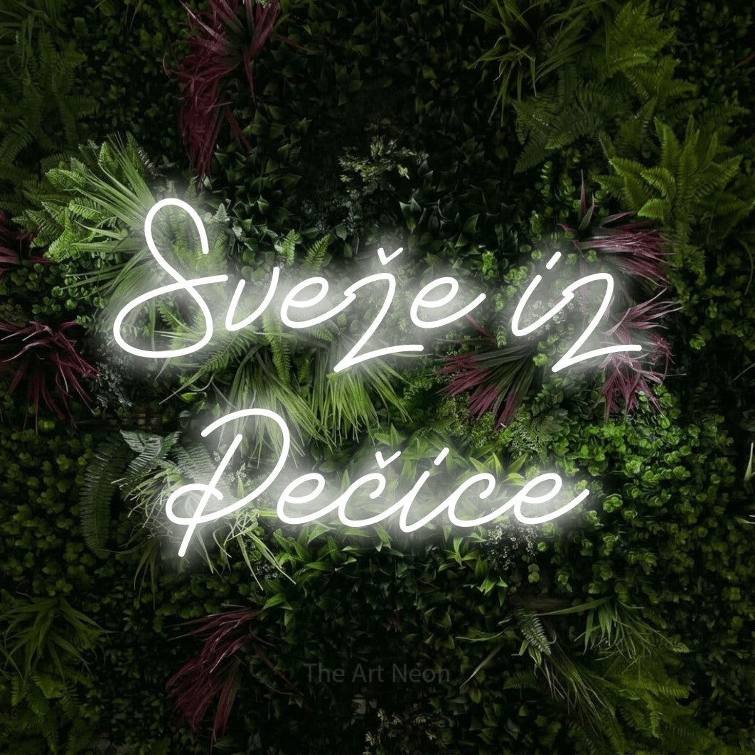 LED neon sign reading “Sveže iz Pečice”, arranged in two lines.