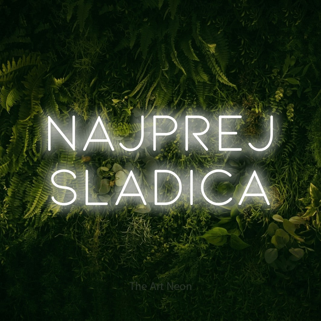 LED neon sign reading “NAJPREJ SLADICA”, arranged in two lines.
