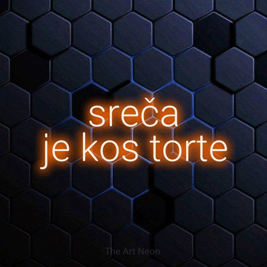 LED neon sign reading “sreča je kos torte”, arranged in two lines.