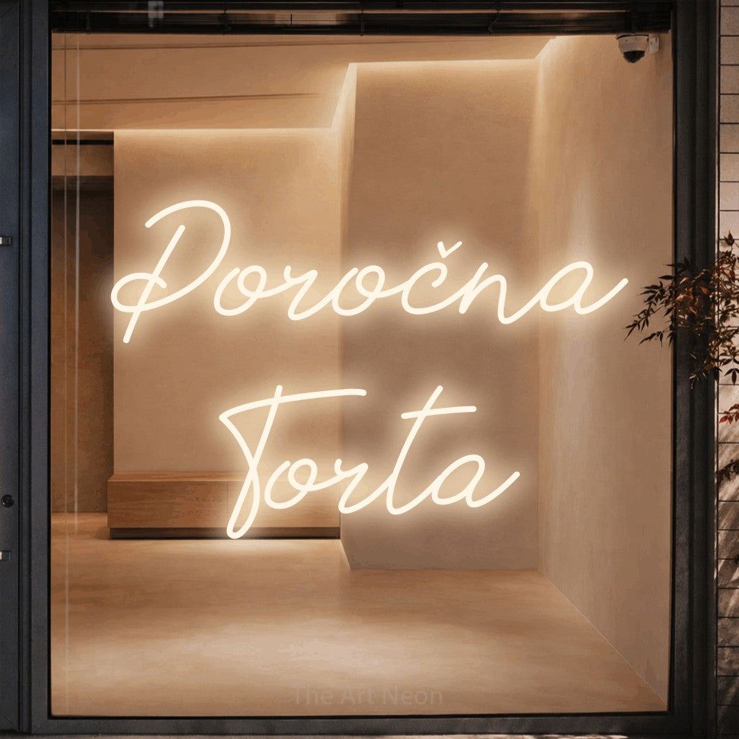 LED neon sign reading “Poročna Torta”, arranged in two lines.