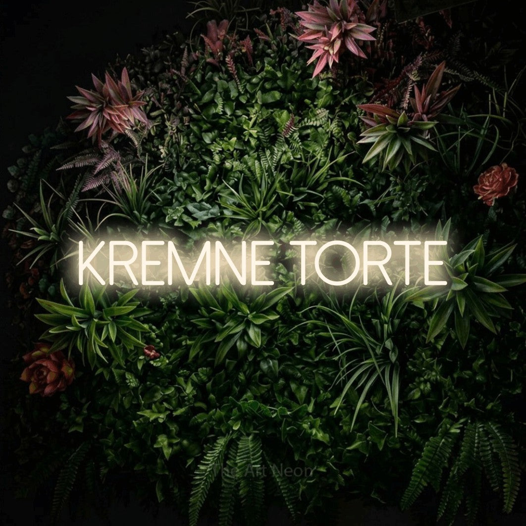 LED neon sign reading “kremne torte”, arranged in a single line.