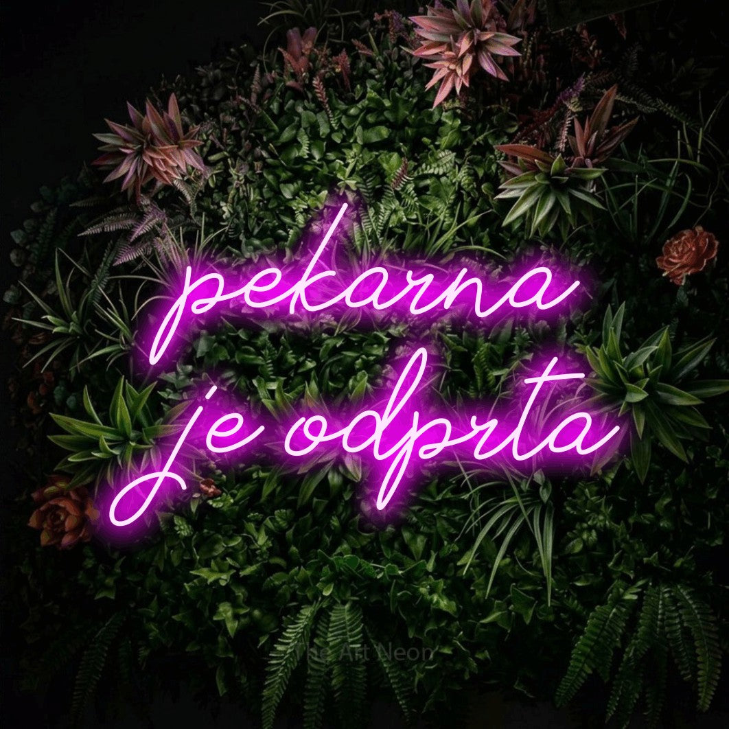 LED neon sign reading “pekarna je odprta”, arranged in two lines.