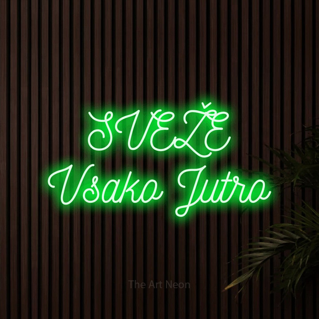 LED neon sign reading “SVEŽE Vsako Jutro”, arranged in two lines.