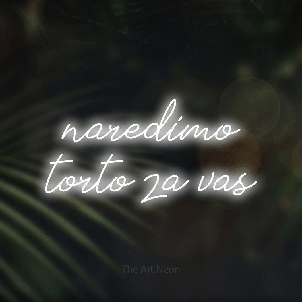 LED neon sign reading “naredimo torto za vas”, arranged in two lines.