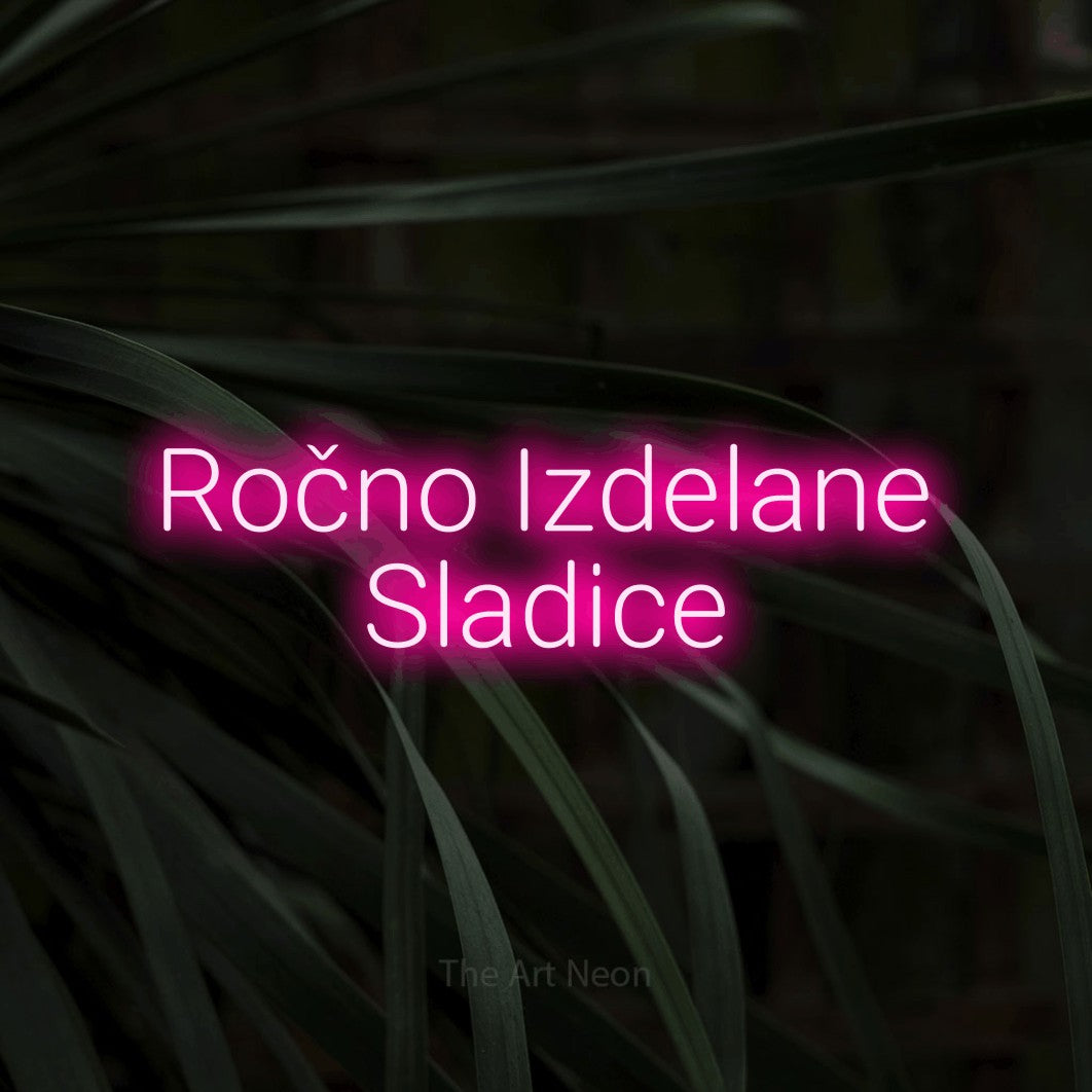 LED neon sign reading “Ročno Izdelane Sladice”, arranged in two lines.