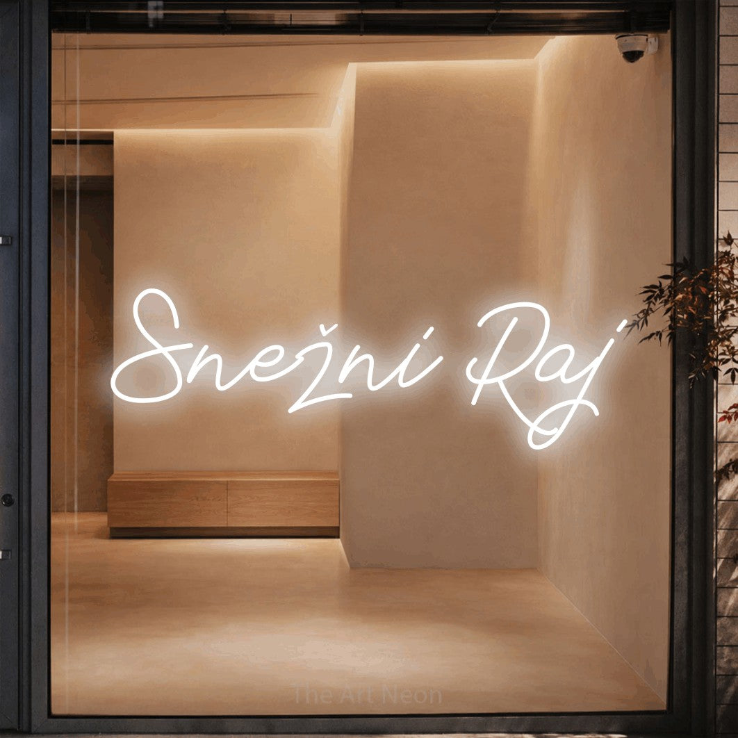 LED neon sign reading “Snežni Raj”, arranged in a single line.