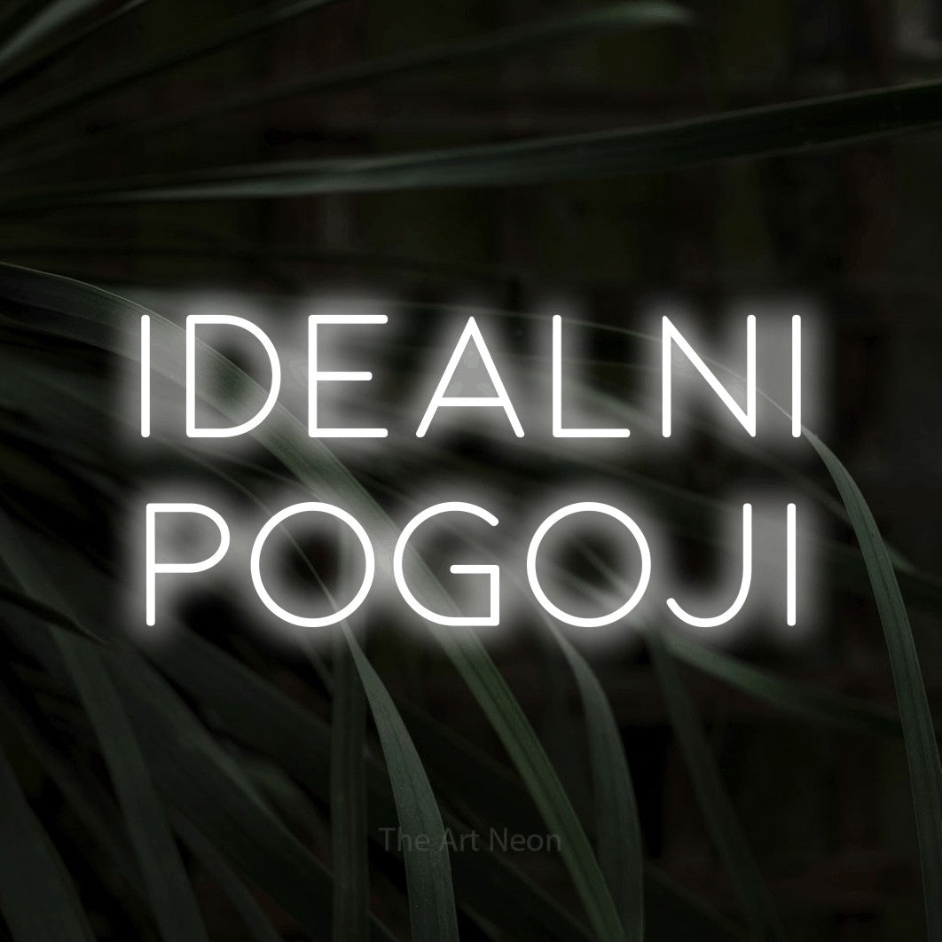 LED neon sign reading “idealni pogoji”, arranged in two lines.