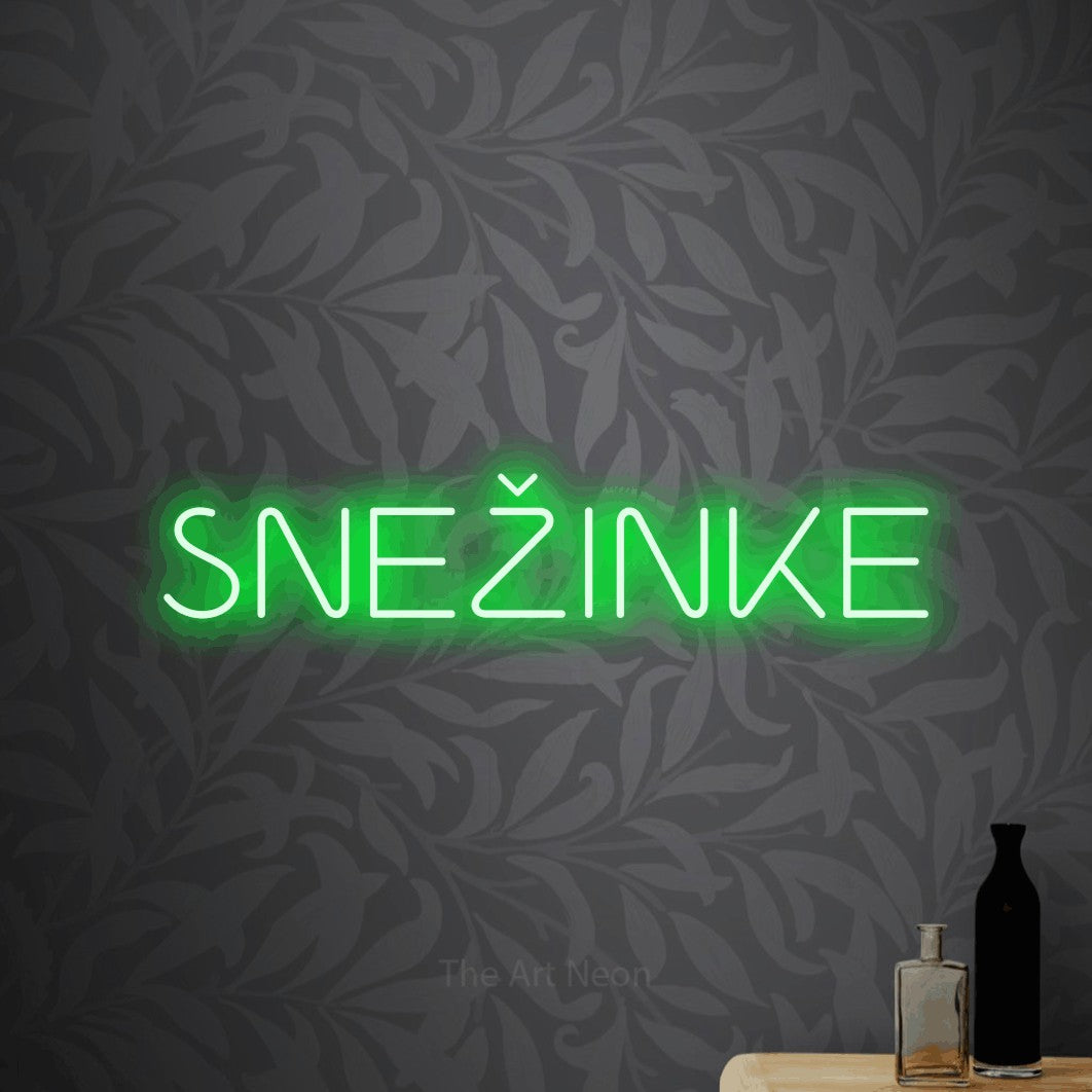 LED neon sign reading “SNEŽINKE”, arranged in a single line.