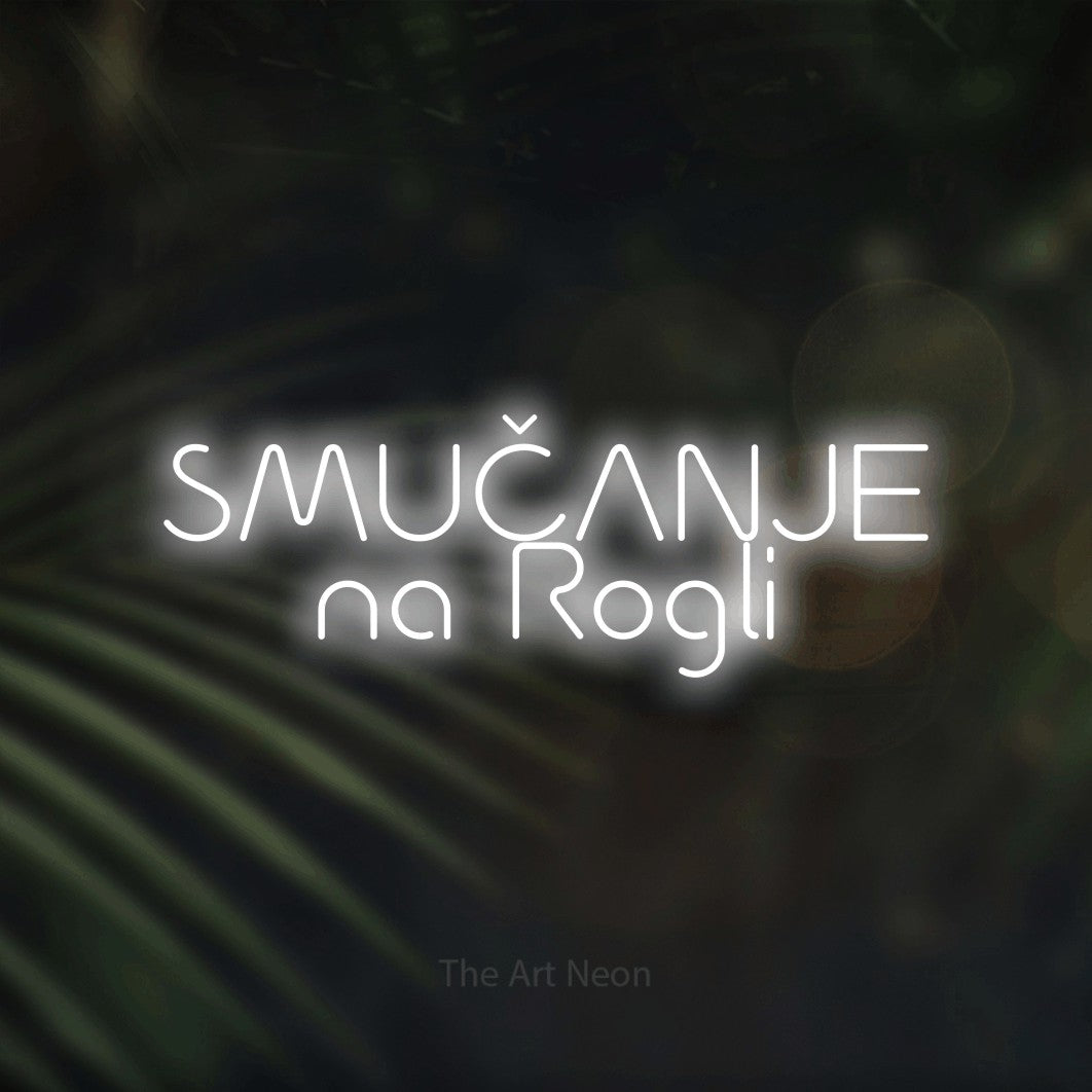 LED neon sign reading “SMUČANJE na Rogli”, arranged in two lines.