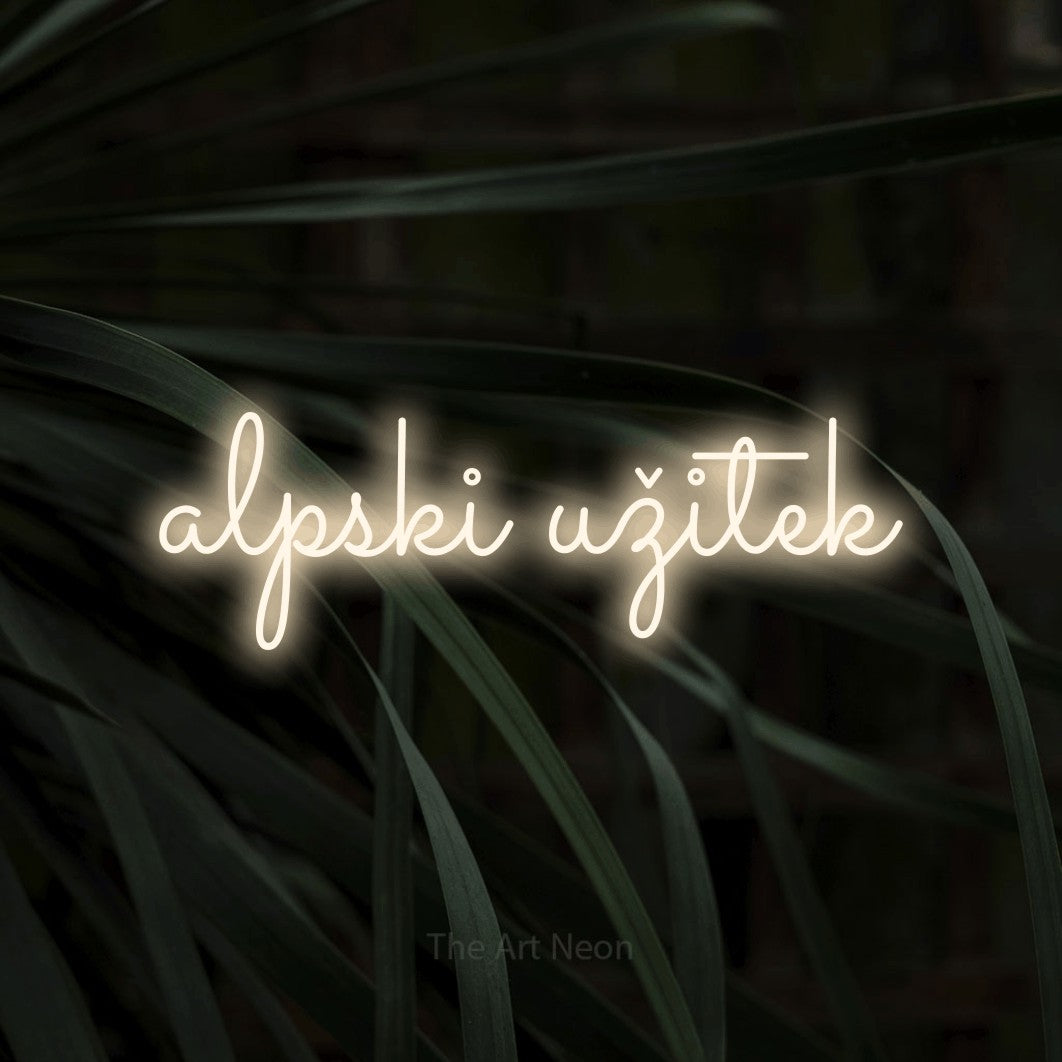 LED neon sign reading “alpski užitek”, arranged in a single line.