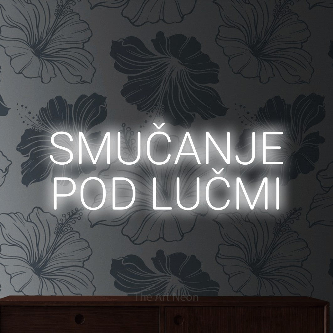 LED neon sign reading “SMUČANJE POD LUČMI”, arranged in two lines.