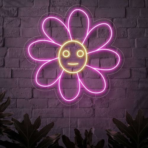 Un'insegna al neon illuminata raffigurante un allegro fiore sorridente, che porta un tocco di natura e fascino floreale in qualsiasi spazio