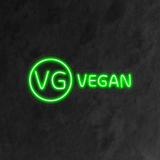 "Vegan Neon Sign" radiates a vibrant glow, celebrating plant-based living and sustainability in your space.