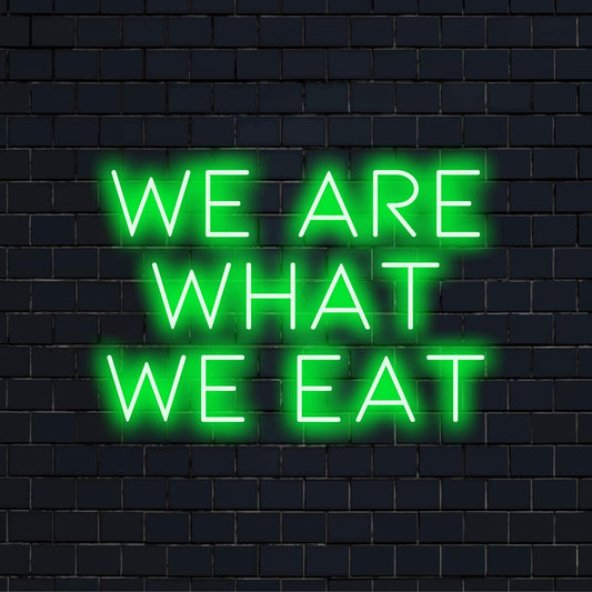 LED-neonskilt, der viser We Are What We Eat, og viser lyst æstetisk neonlyskunst perfekt til moderne indretning.