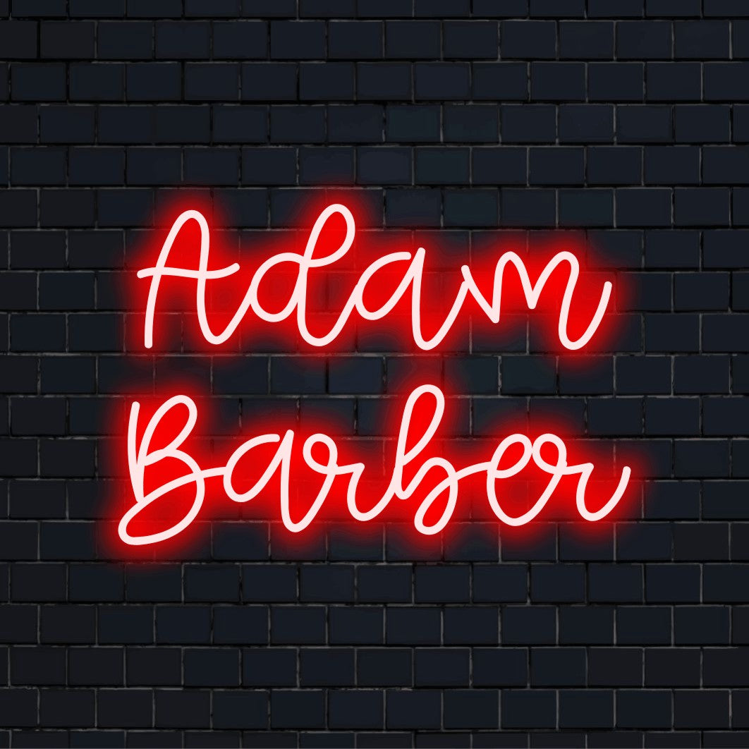 Adam Barber Personalized Neon Light with glowing wall decor on dark brick wall