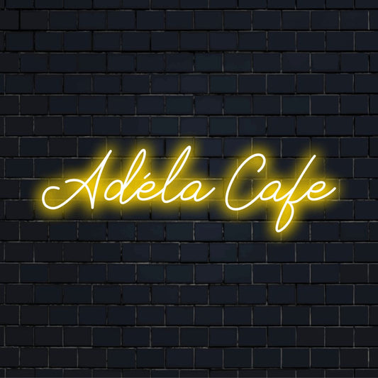 Adela Cafe Personalized LED Neon Sign, bright LED glow on dark brick background
