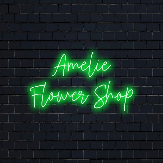 Amelie Flower Shop Personalized Neon Light with bright neon glow on dark brick background