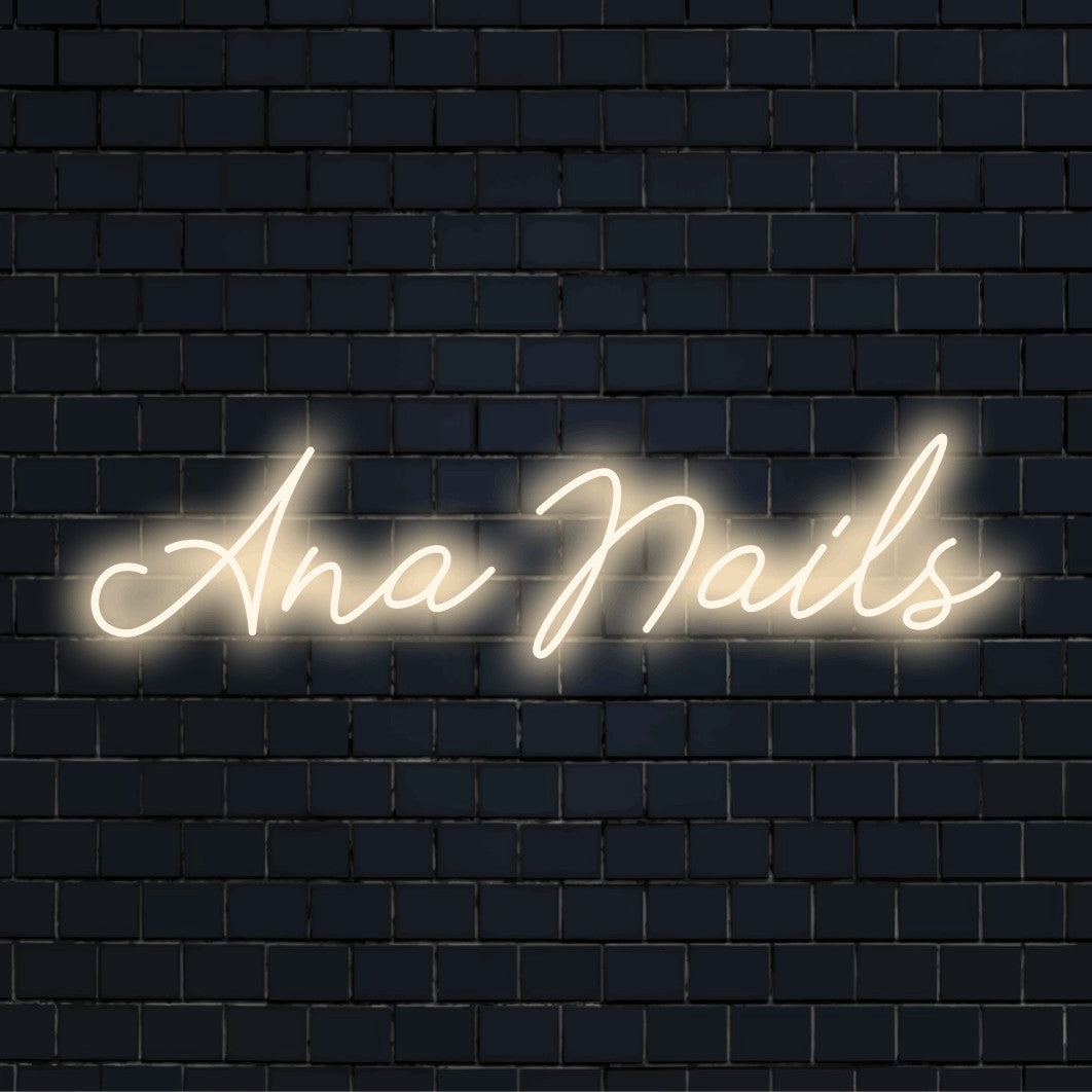 Ana Nails Personalized LED Neon Sign, glowing lettering on dark brick background