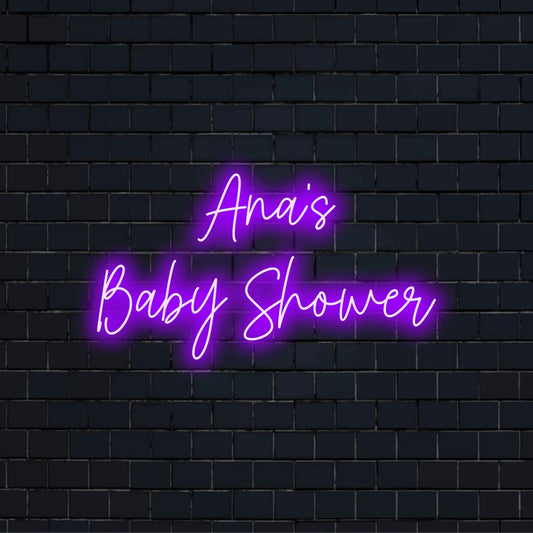 Ana_s Baby Shower Custom Name Neon Sign, glowing lettering against black brick wall