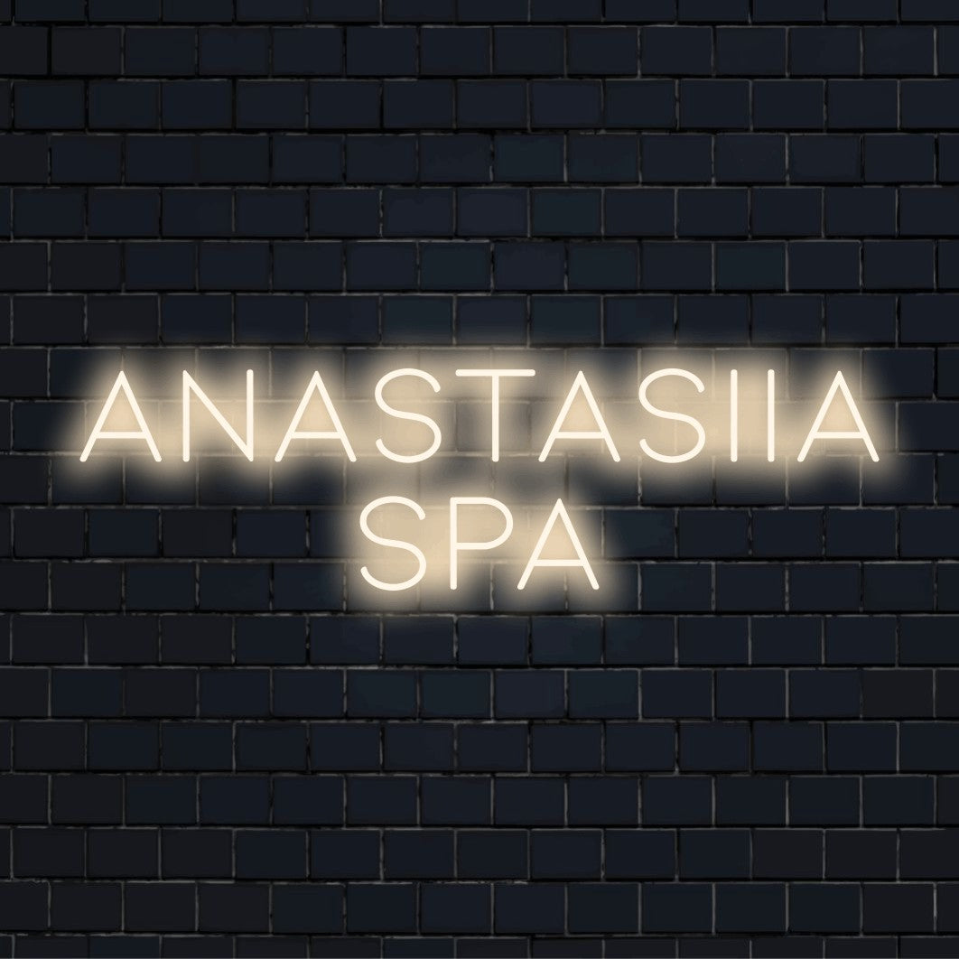 Anastasiia Spa Personalized LED Neon Sign, glowing wall decor against brick backdrop