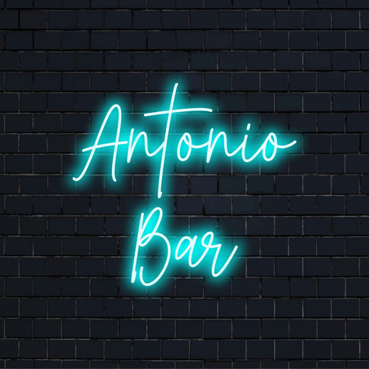Antonio Bar Personalized LED Neon Sign, glowing lettering against brick backdrop