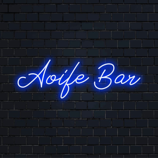 Aoife Bar Personalized Neon Light with glowing wall decor on dark brick wall