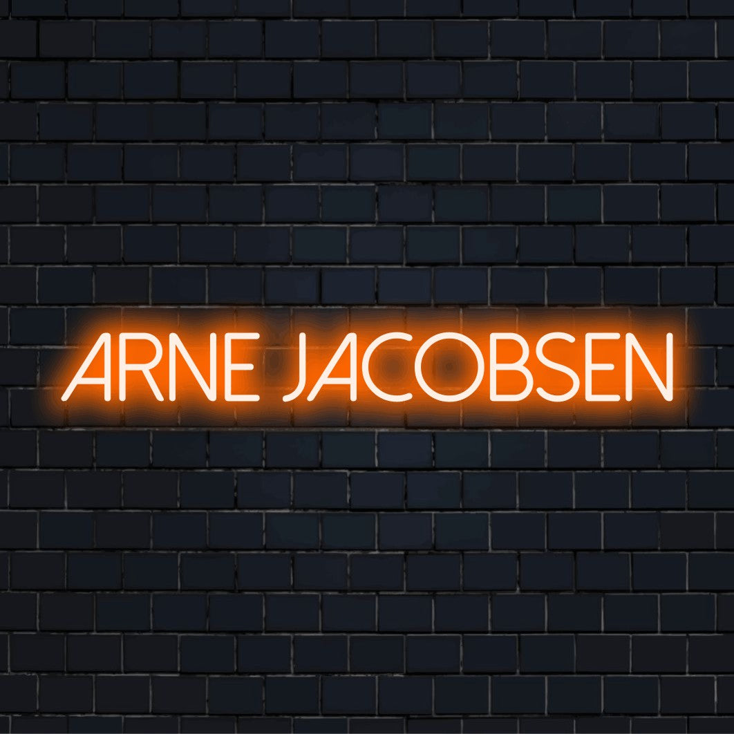 Arne Jacobsen Neon Light with glowing neon text against black brick wall