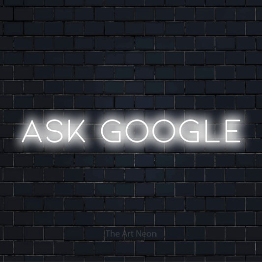 "Ask Google" glowing LED neon sign on a black brick wall
