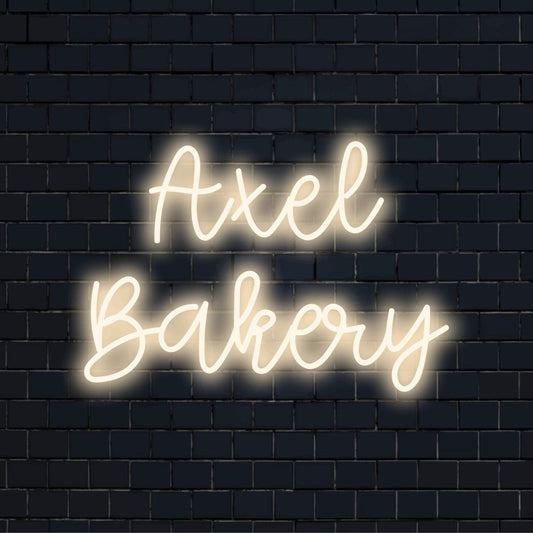 Axel Bakery Custom Name Neon Sign, neon text light against brick backdrop