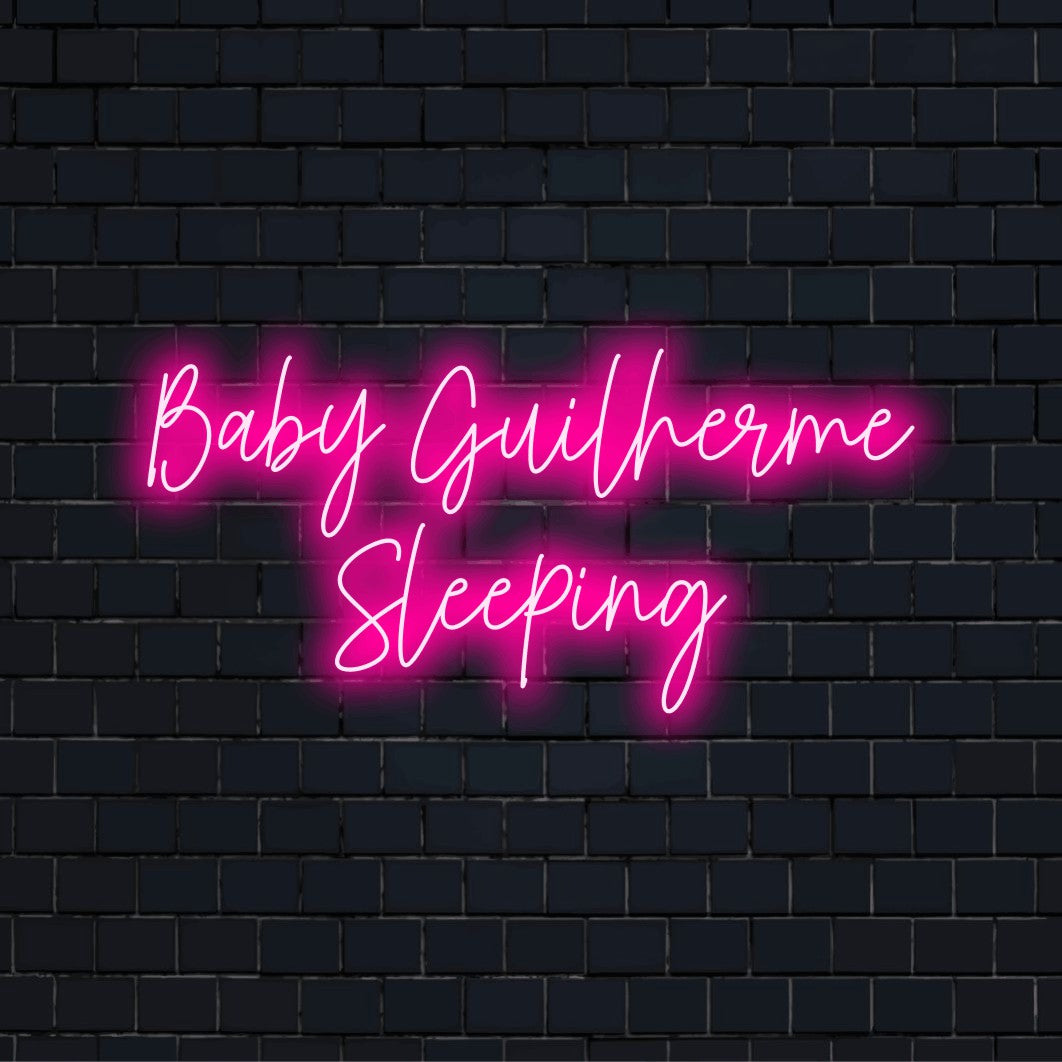 Baby Guilherme Sleeping Custom Name Neon Sign, bright LED glow against black brick wall