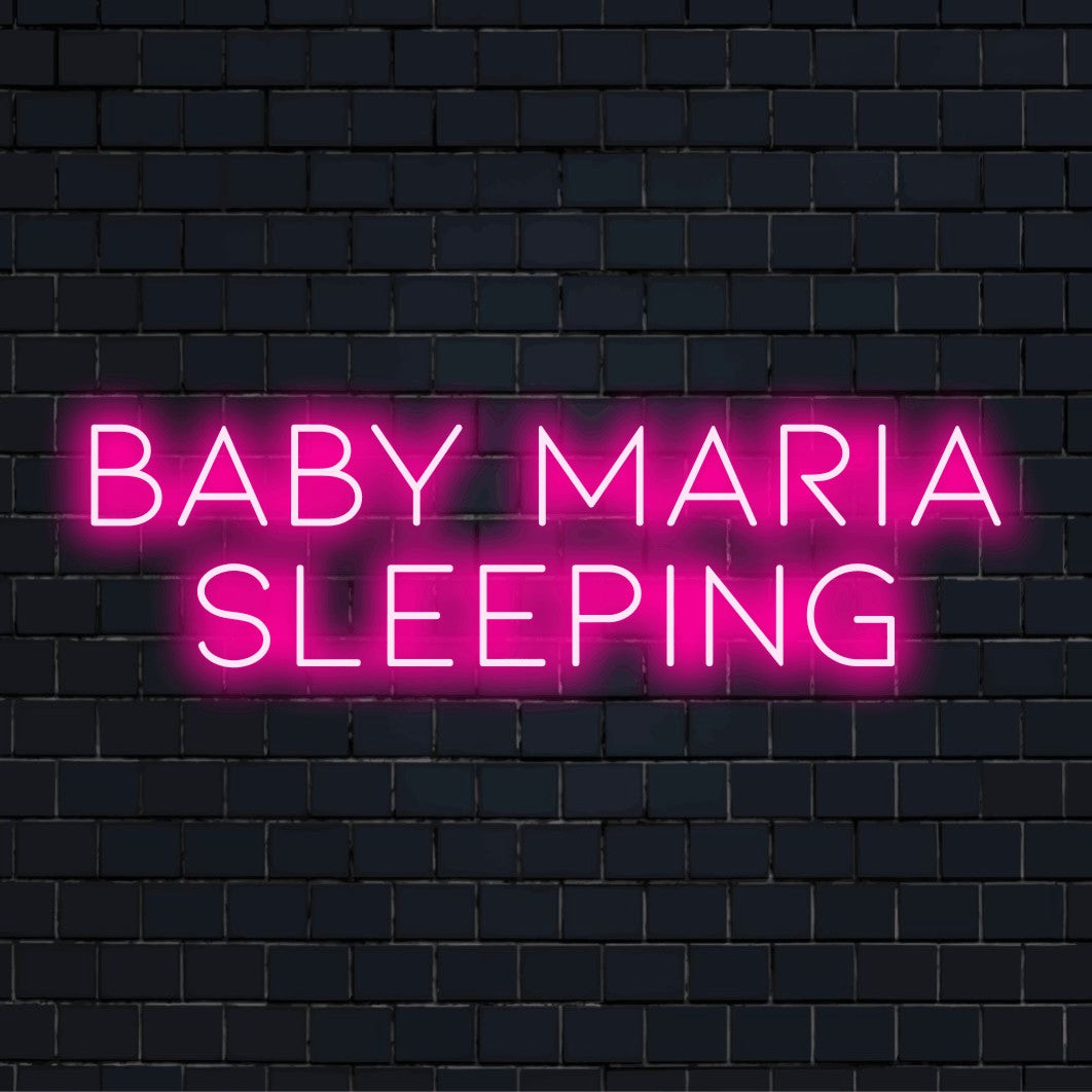 Baby Maria Sleeping Personalized LED Neon Sign, bright neon lettering against brick backdrop
