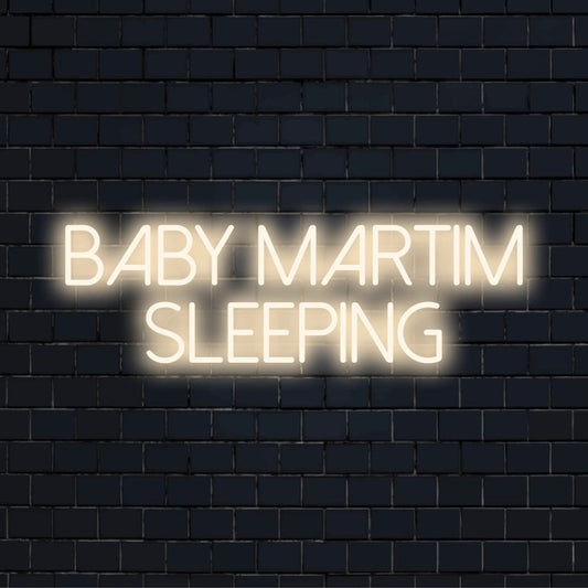 Baby Martim Sleeping Custom Name Neon Sign, glowing neon text on dark brick wall