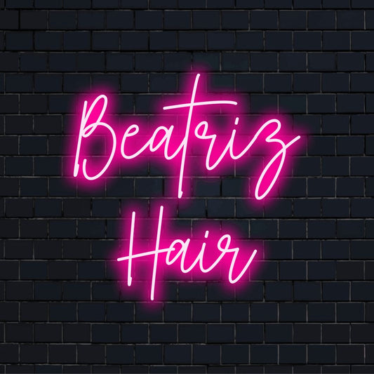 Beatriz Hair Personalized Neon Light with glowing wall decor against black brick wall