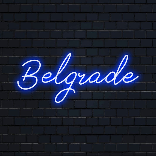 Belgrade Neon Light with bright neon lettering against brick backdrop