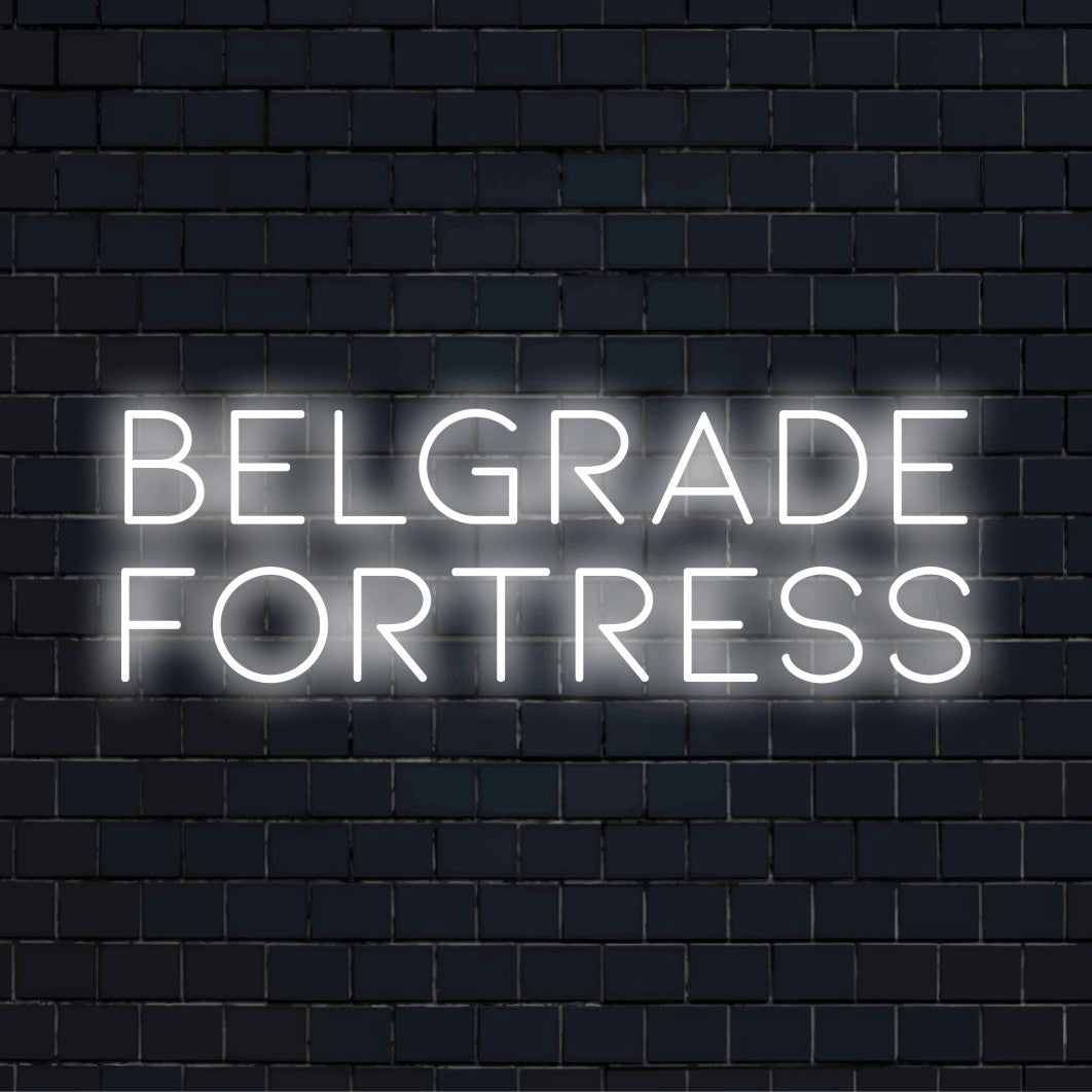 Belgrade Fortress Neon Light with glowing neon text on dark brick background